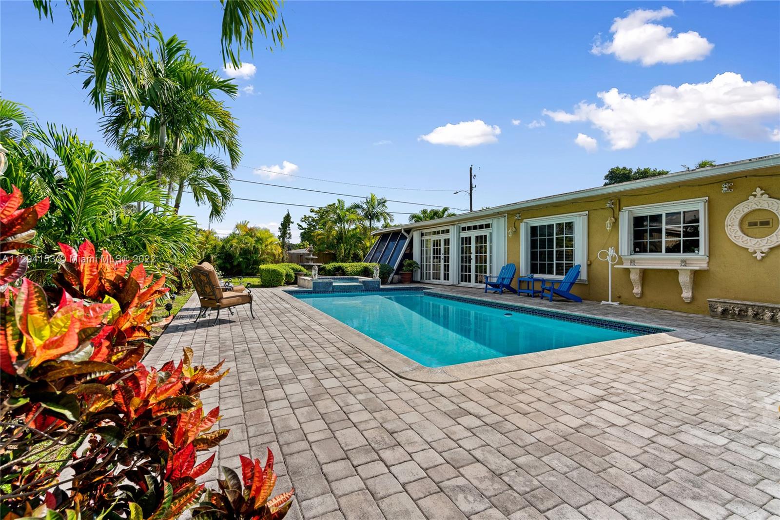 9901 Southwest 35th Terrace Miami, FL 33165 - Photo 41 of 50 a view of a house with a swimming pool and sitting area