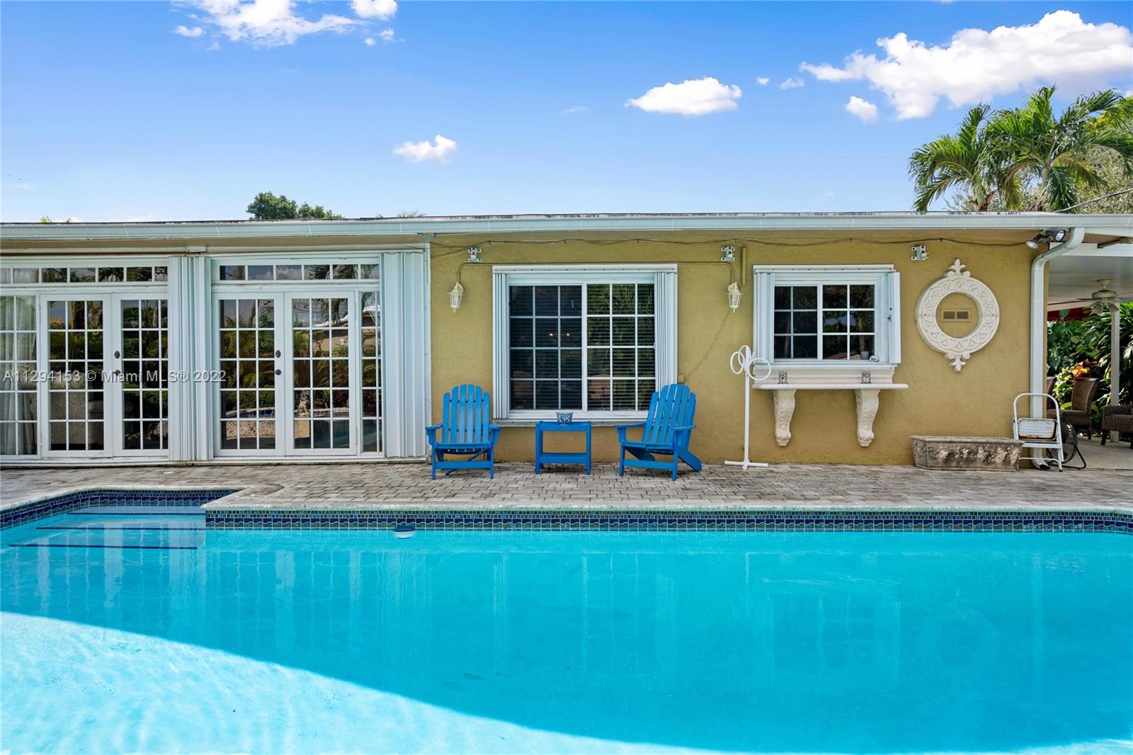 9901 Southwest 35th Terrace Miami, FL 33165 - Photo 42 of 50 a front view of a house with a yard