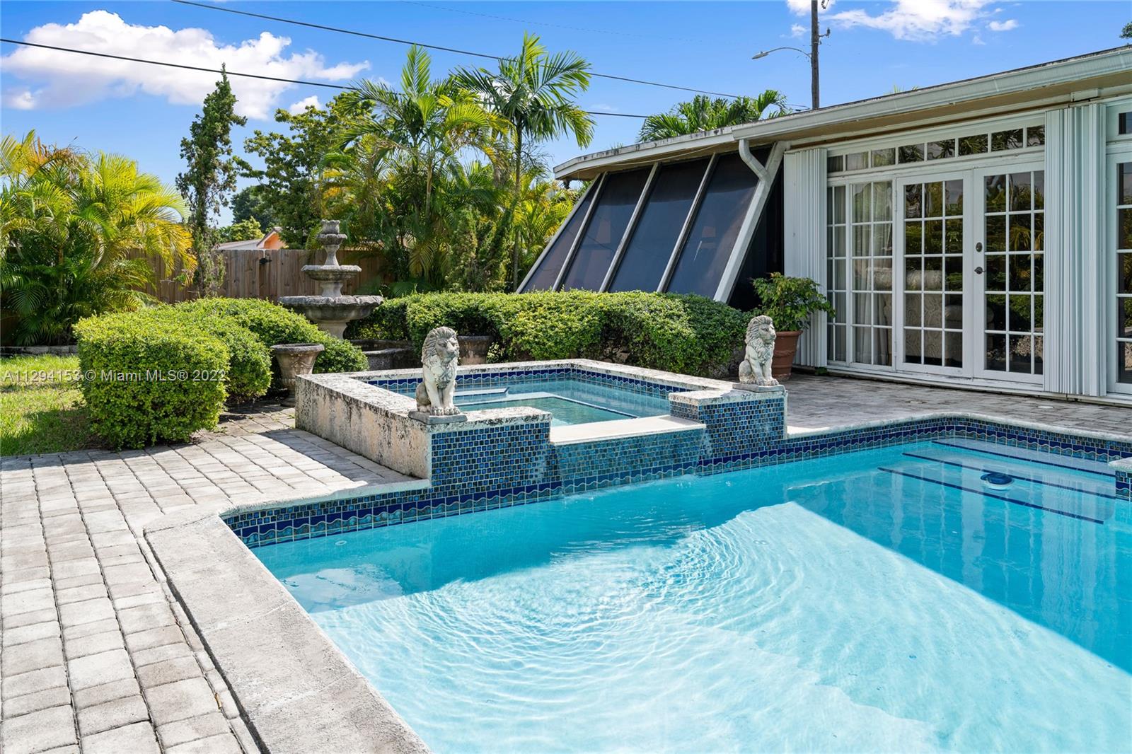 9901 Southwest 35th Terrace Miami, FL 33165 - Photo 43 of 50 a view of a backyard with sitting area