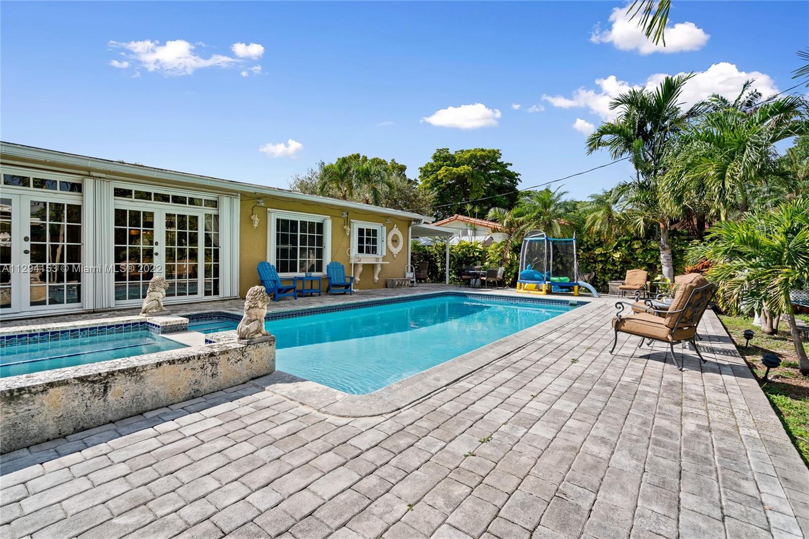 9901 Southwest 35th Terrace Miami, FL 33165 - Photo 44 of 50 a view of a house with backyard porch and sitting area