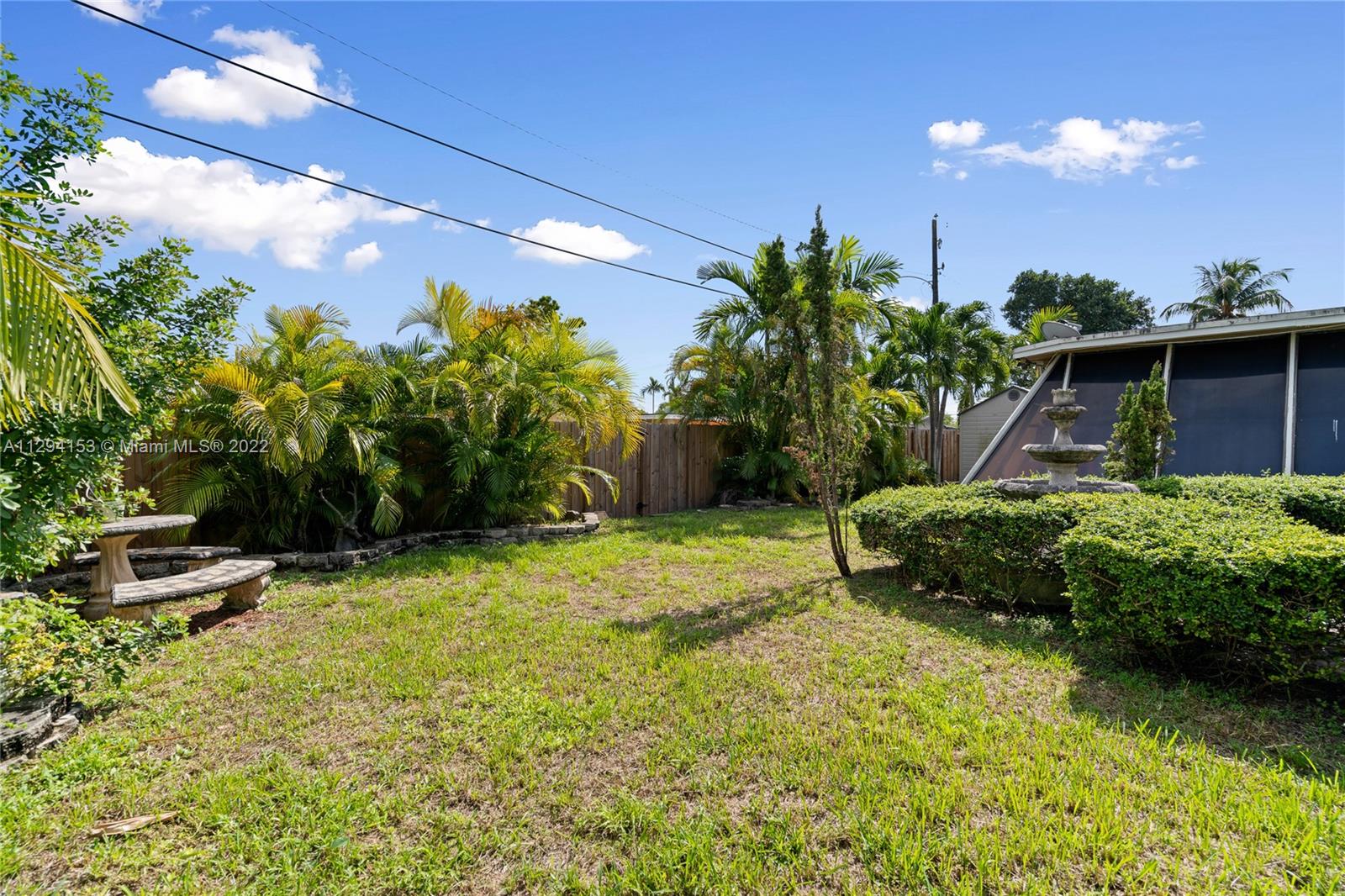 9901 Southwest 35th Terrace Miami, FL 33165 - Photo 48 of 50 a garden view with a seating space
