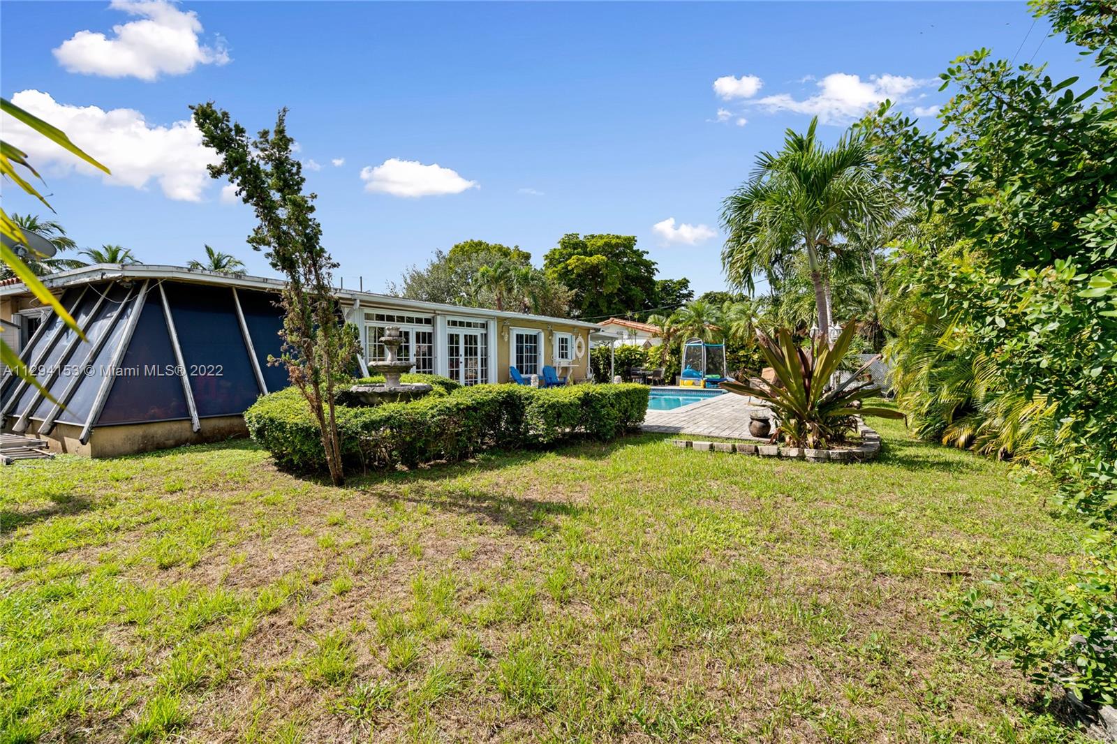 9901 Southwest 35th Terrace Miami, FL 33165 - Photo 50 of 50 a view of a house with backyard and sitting area