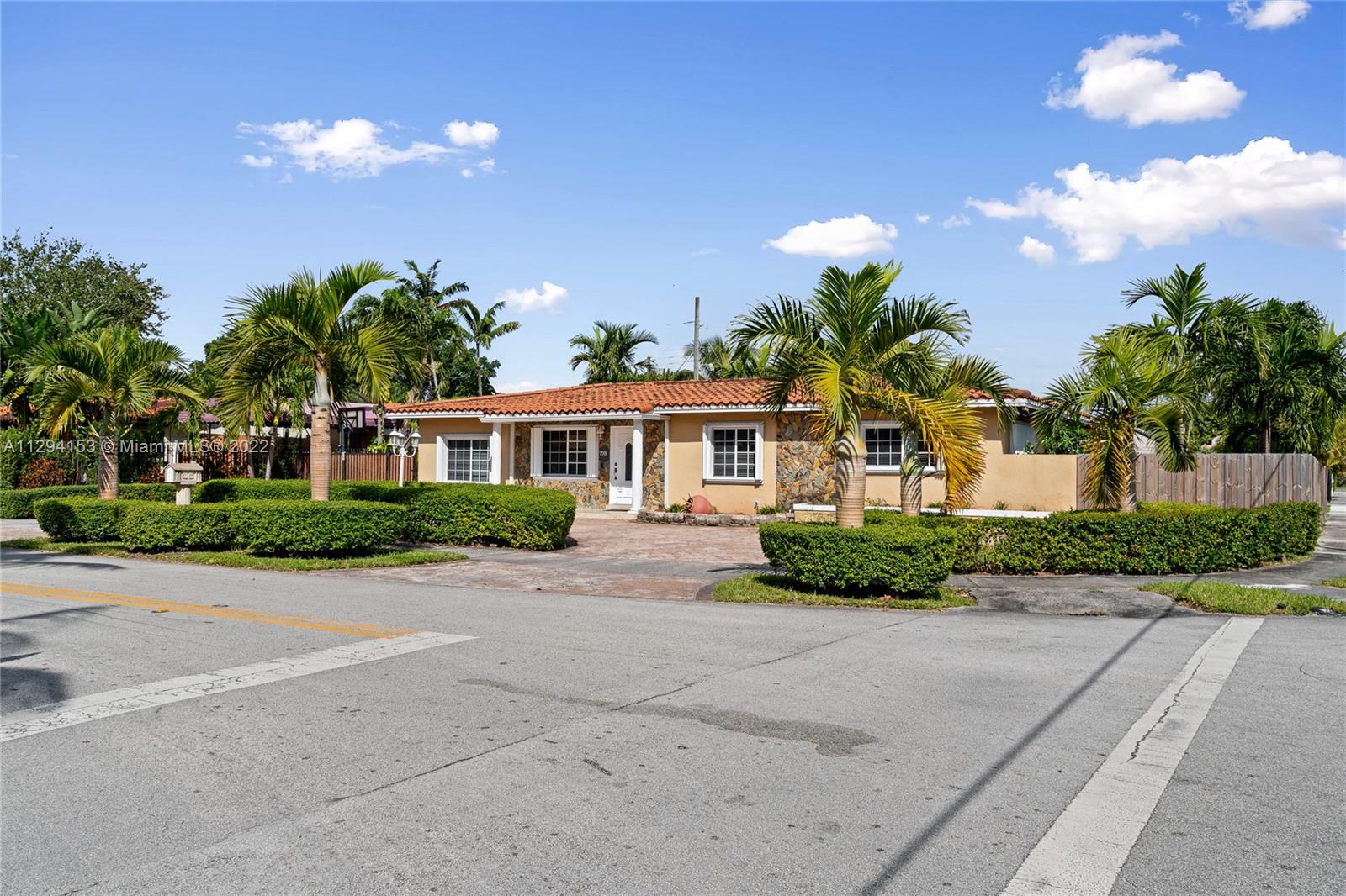 9901 Southwest 35th Terrace Miami, FL 33165 - Photo 5 of 50 a front view of a house with a yard and a garage