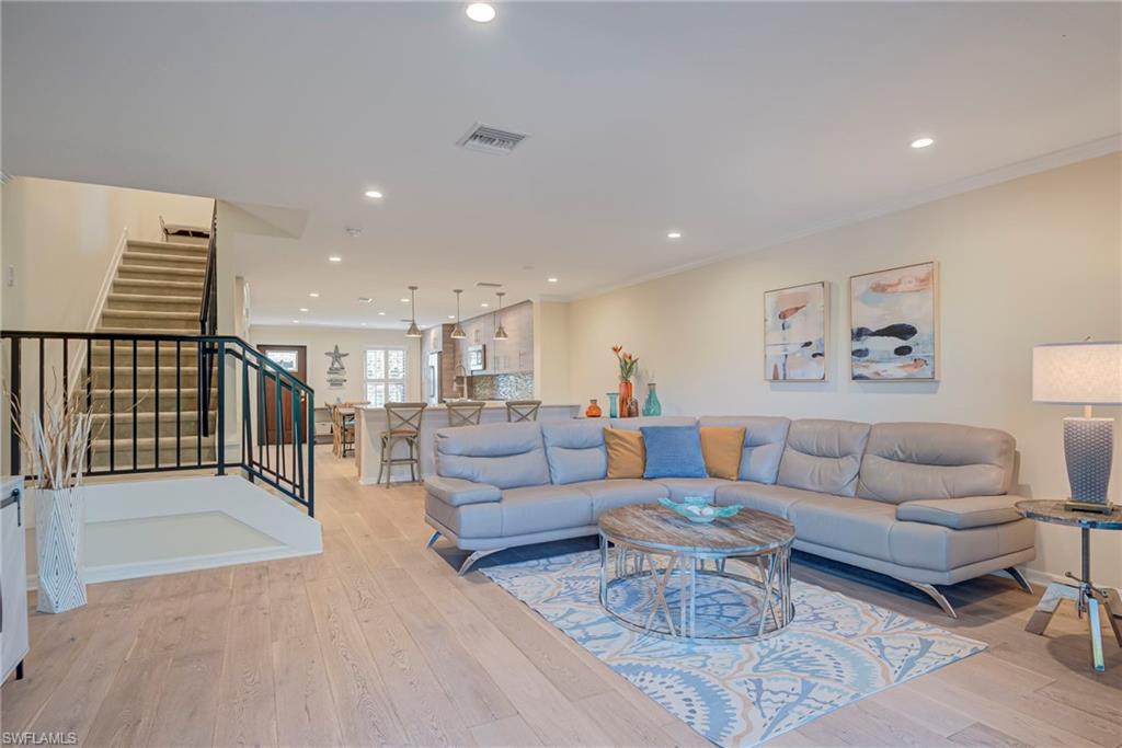 1070 6th Street South, Unit 1070 Naples, FL 34102 - Photo 41 of 41 Open floor plan easy to entertain from inside to outside! Dining area, bar area, and living area featuring recessed lighting, light wood style floors, and ornamental molding