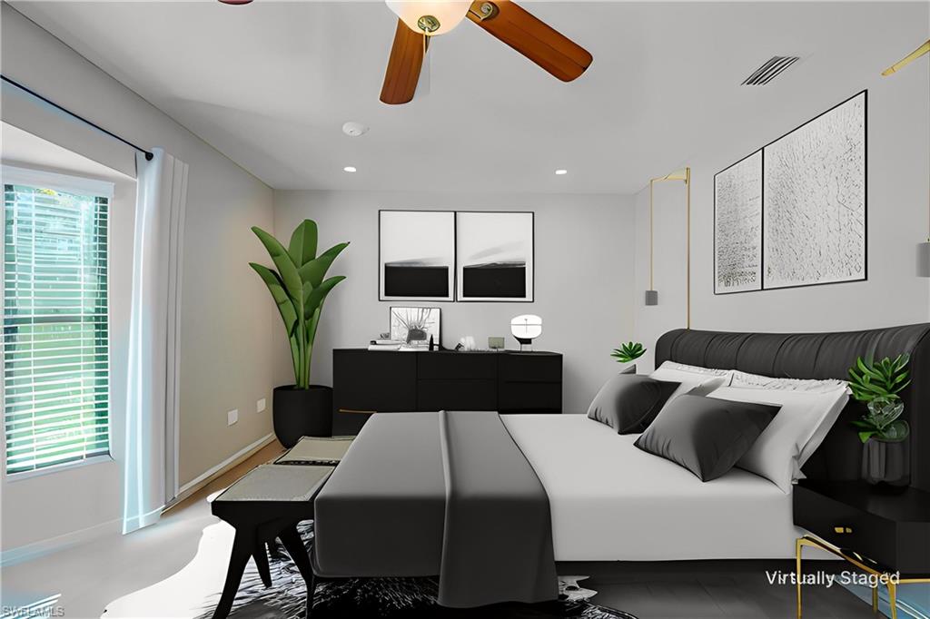 1070 6th Street South, Unit 1070 Naples, FL 34102 - Photo 22 of 41 Virtually staging of this to show a different style and placement! Bedroom featuring recessed lighting and ceiling fan- lots of light with the windows