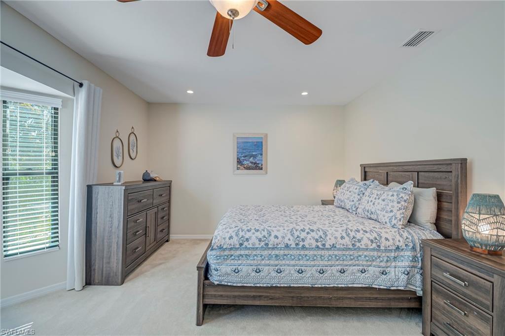 1070 6th Street South, Unit 1070 Naples, FL 34102 - Photo 24 of 41 Bedroom with light carpet, a ceiling fan, and recessed lighting. This room could be used as a home office or have two twin beds.