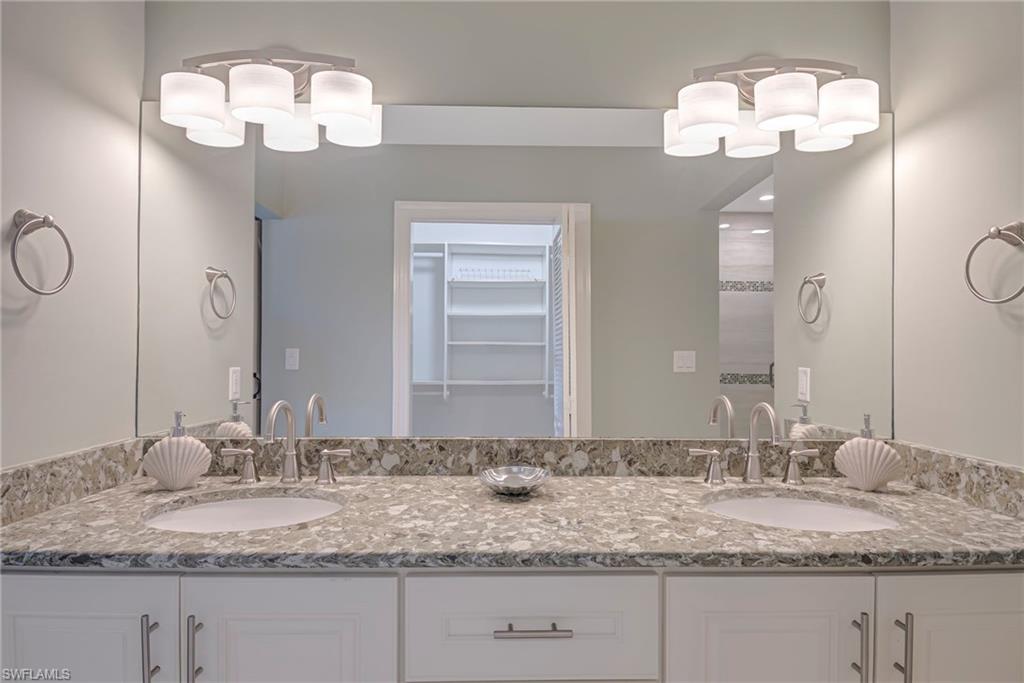 1070 6th Street South, Unit 1070 Naples, FL 34102 - Photo 33 of 41 Full bath with double vanity & spacious closet