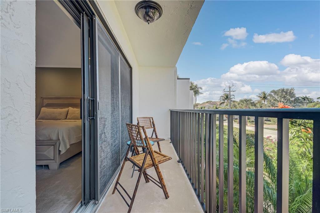 1070 6th Street South, Unit 1070 Naples, FL 34102 - Photo 37 of 41 View of balcony off of primary bedroom - perfect for sunsets!