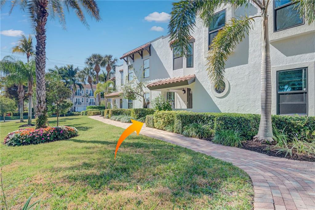 1070 6th Street South, Unit 1070 Naples, FL 34102 - Photo 3 of 41 View of property's front elevation and walkway to front entrance of the unit
