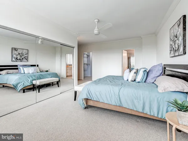 a spacious bathroom with a granite countertop sink and a large mirror