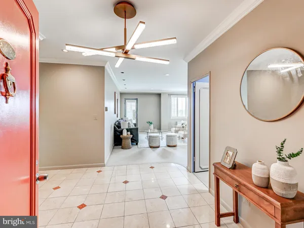 a view of a livingroom with furniture and a mirror