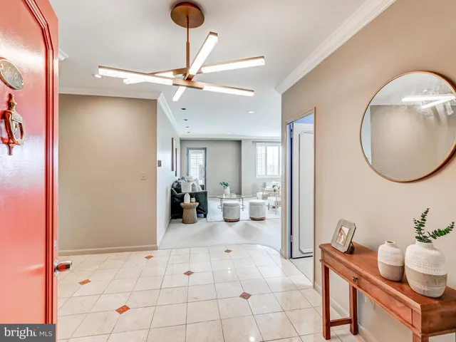 a view of a livingroom with furniture and a mirror