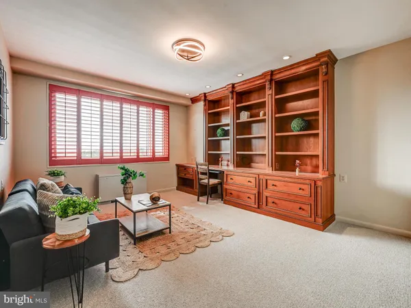 an empty room with a window and closet