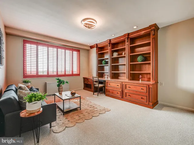 an empty room with a window and closet