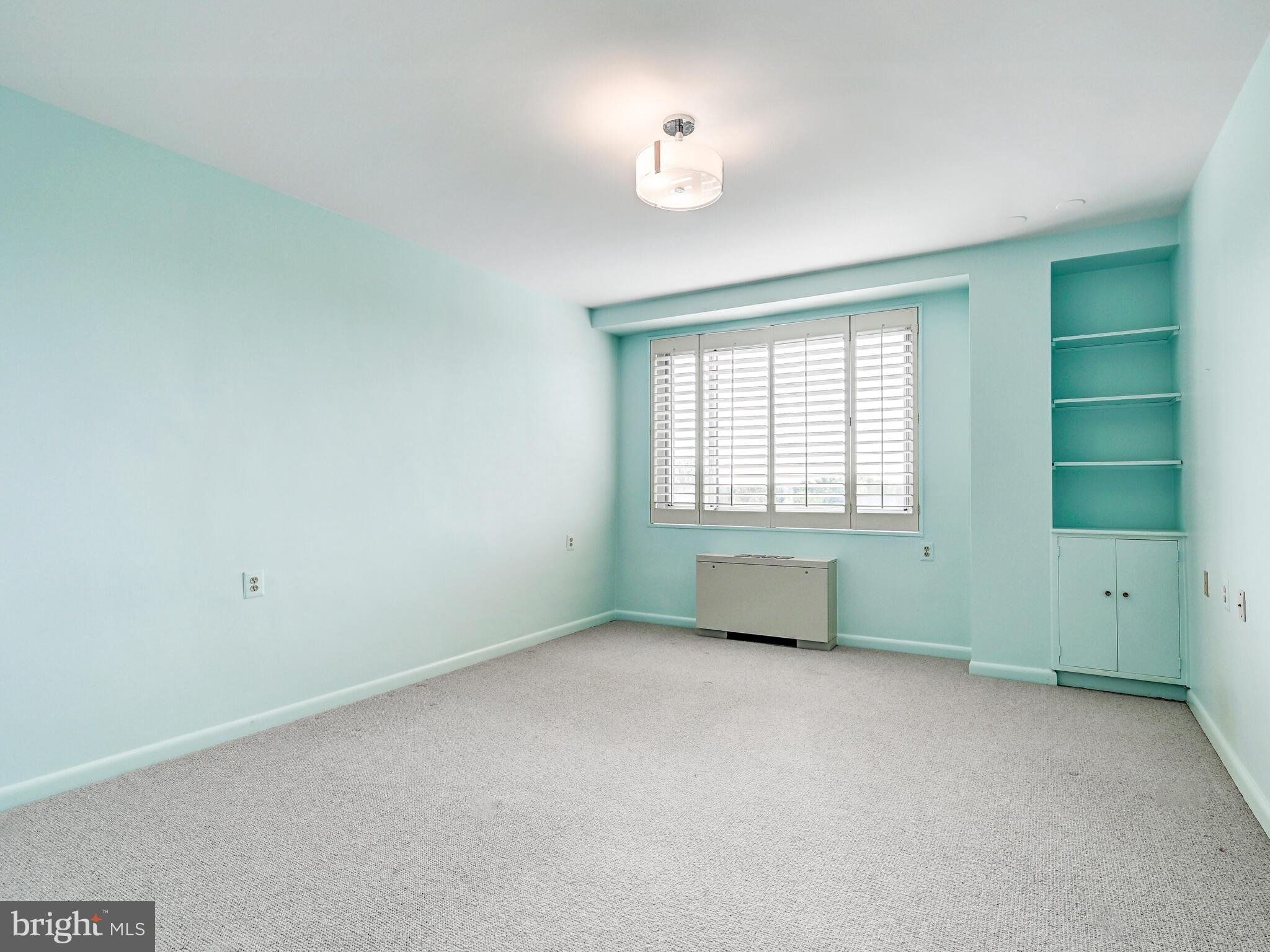 11 Slade Avenue, Unit 912 Baltimore, MD 21208 - Photo 23 of 31 an empty room with a window and closet