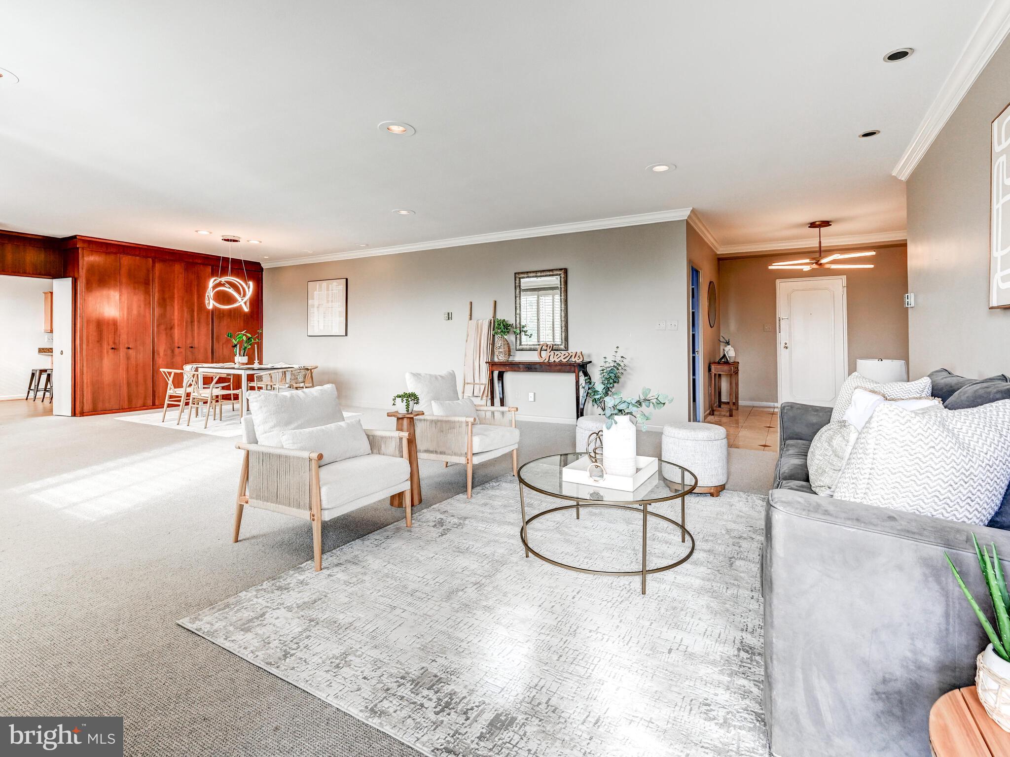 11 Slade Avenue, Unit 912 Baltimore, MD 21208 - Photo 5 of 31 a living room with furniture and a wooden floor