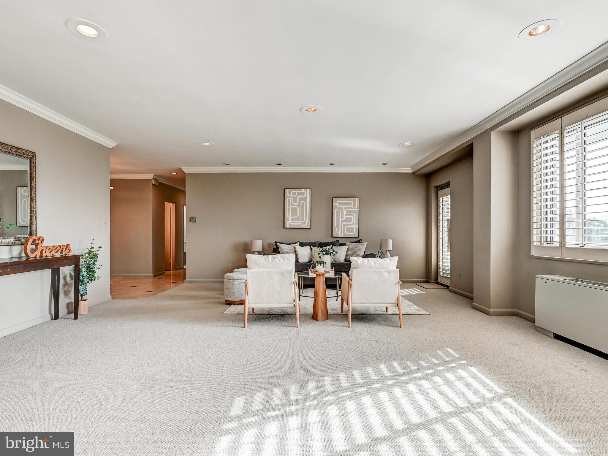 11 Slade Avenue, Unit 912 Baltimore, MD 21208 - Photo 6 of 31 a living room with furniture and a window