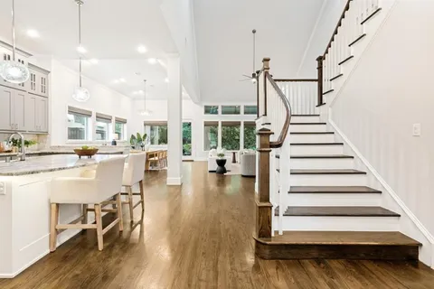 a view of a living room and entry way