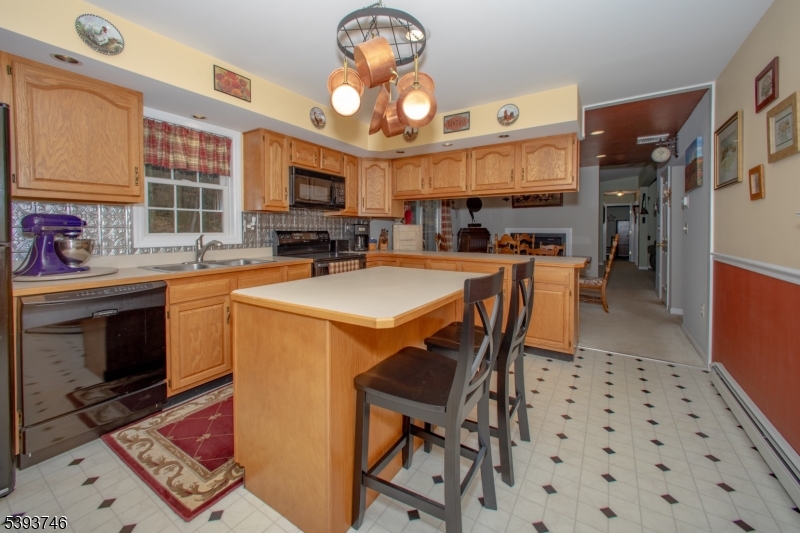 5 Twin Pond Road Montague, NJ 07827 - Photo 19 of 29 a kitchen with a sink a stove and cabinets
