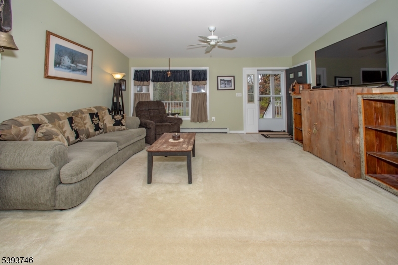 5 Twin Pond Road Montague, NJ 07827 - Photo 5 of 29 a living room with furniture and a flat screen tv