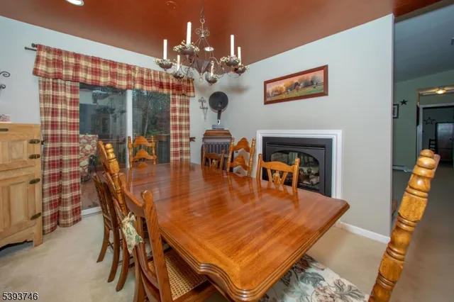 a large kitchen with stainless steel appliances a stove a sink dishwasher and cabinets with wooden floor