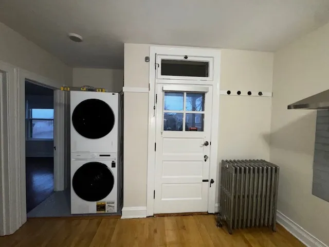 a view of a hallway with washer and dryer