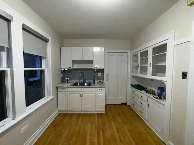 a kitchen with stainless steel appliances a stove a sink and a refrigerator