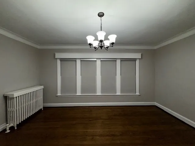 a view of wooden door in the room