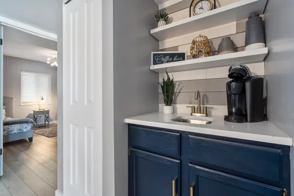 a en suite bathroom with a sink and mirror
