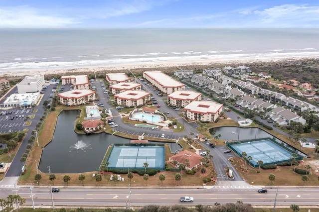 an aerial view of residential houses with outdoor space