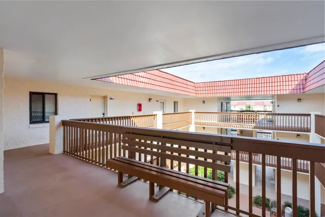 a view of a porch with wooden floor