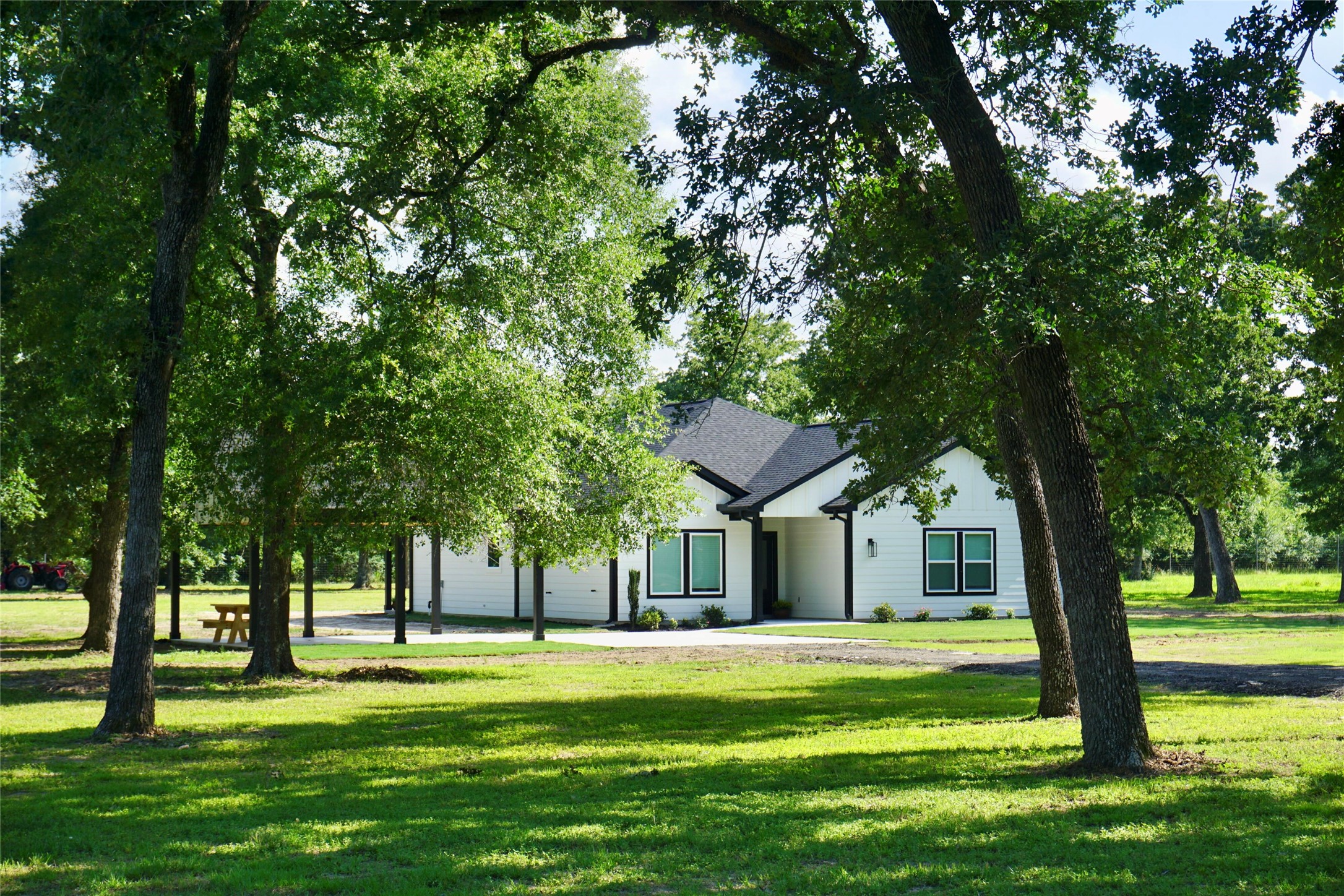 39645 Bosque Road Hempstead, TX 77445 - Photo 3 of 37 a front view of a house with a garden
