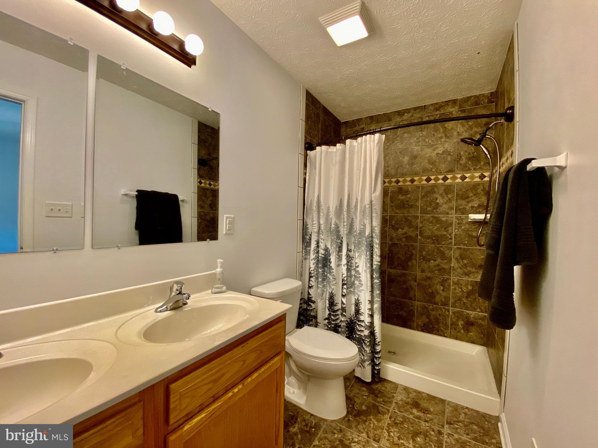 70 Spring Hollow Road Front Royal, VA 22630 - Photo 27 of 38 Master Bathroom with Ceramic Tile & Dual Shower
