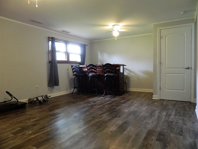 15210 Ridgeway Avenue Midlothian, IL 60445 - Photo 16 of 19 wooden floor and windows in a room