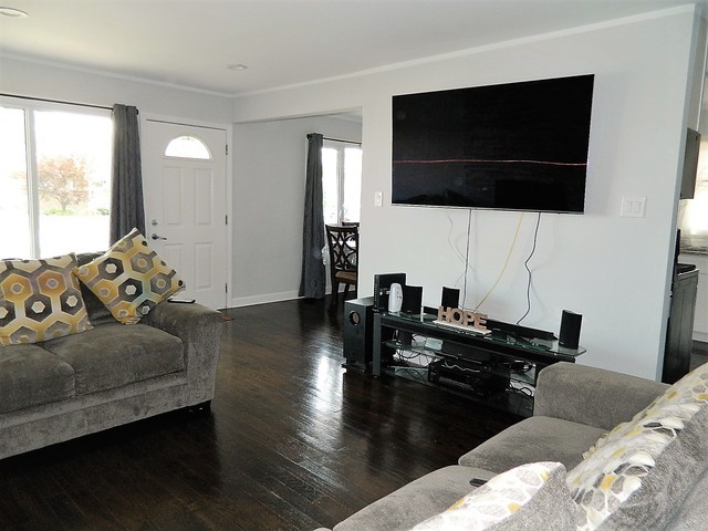 15210 Ridgeway Avenue Midlothian, IL 60445 - Photo 3 of 19 a living room with furniture and a flat screen tv