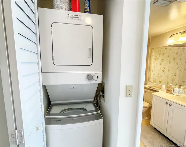 a bedroom with a bed and a lamp