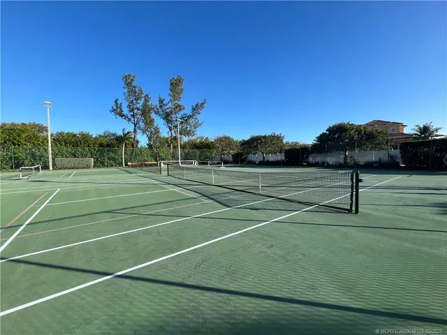 a swimming pool view with a lake view