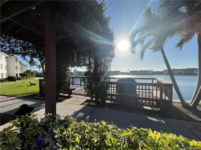 a view of a garden with sitting area