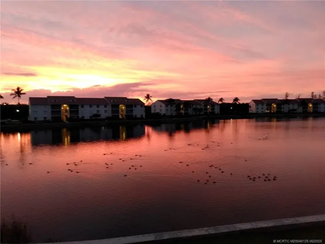 a view of swimming pool with a table and chairs