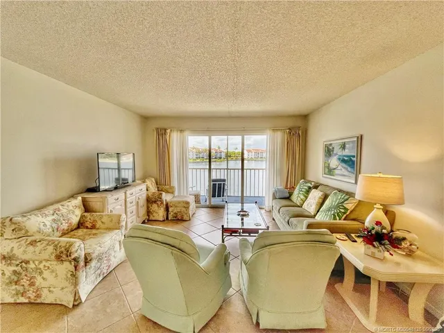 a kitchen with stainless steel appliances a stove a sink and a refrigerator