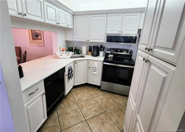 a kitchen with a stove and a refrigerator
