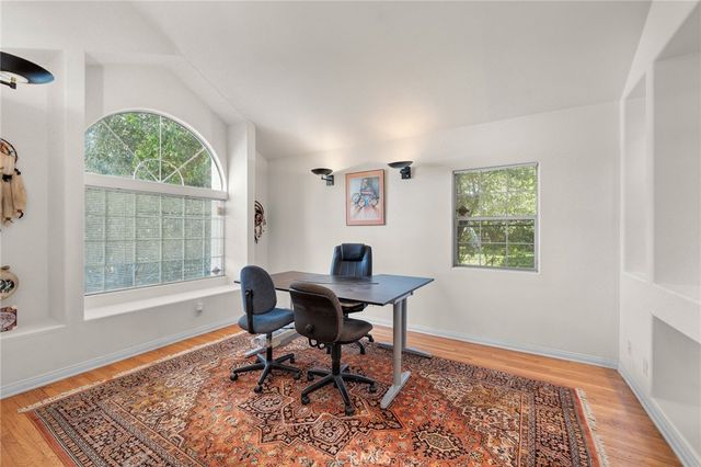 a work room with furniture and a window