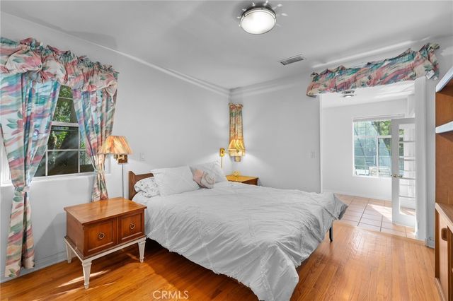 a living room with furniture and a piano