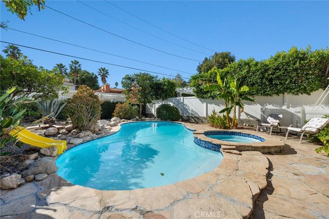an aerial view of a house with outdoor space