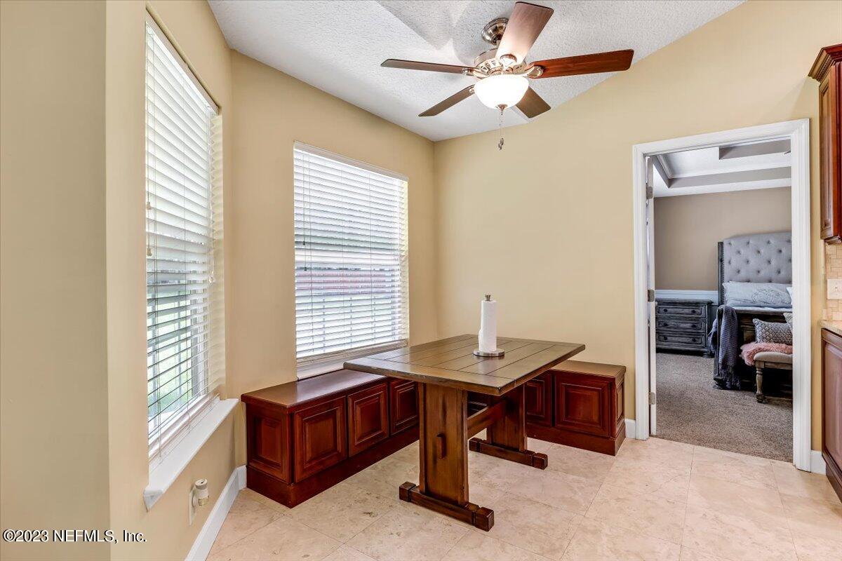 4616 Estates Street Macclenny, FL 32063 - Photo 14 of 32 a living room with furniture and a table