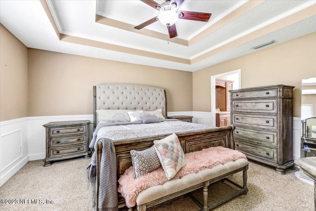 4616 Estates Street Macclenny, FL 32063 - Photo 15 of 32 a bedroom with a bed and a cabinets