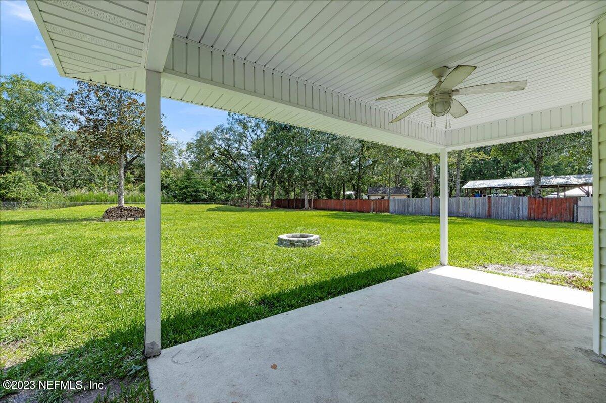 4616 Estates Street Macclenny, FL 32063 - Photo 28 of 32 a view of a house with a yard