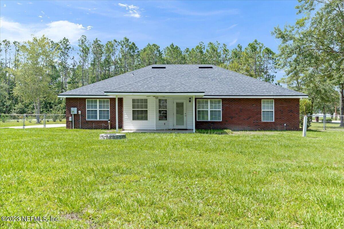 4616 Estates Street Macclenny, FL 32063 - Photo 29 of 32 a house view with a garden space