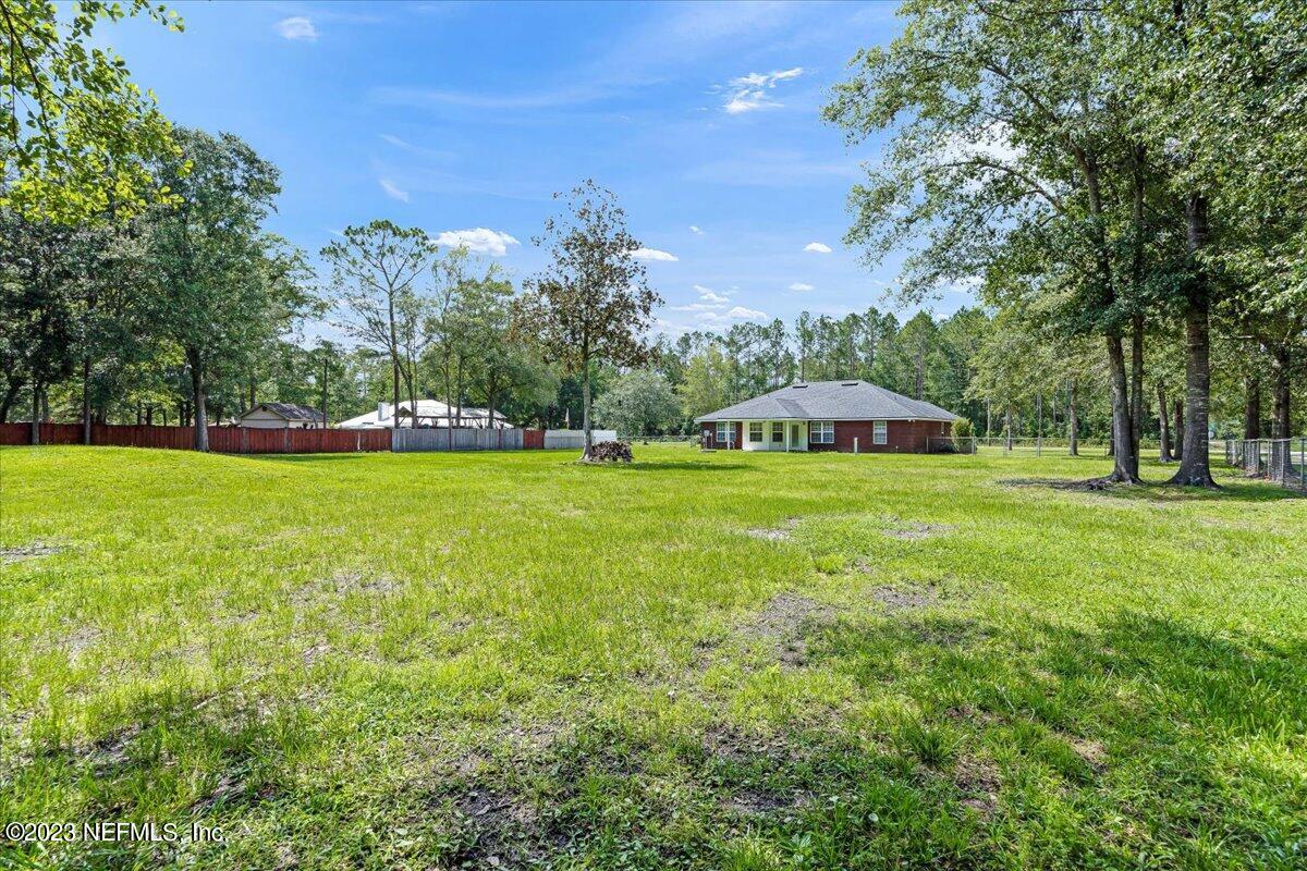 4616 Estates Street Macclenny, FL 32063 - Photo 32 of 32 a view of a park with large trees