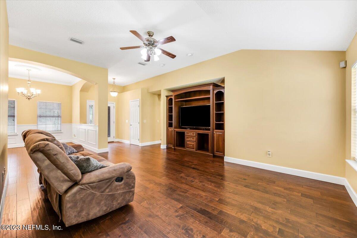 4616 Estates Street Macclenny, FL 32063 - Photo 8 of 32 a living room with furniture and a flat screen tv